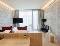 Beispiel eines Doppelzimmers mit Sichtbeton im Loisium Wine Spa Hotel Langenlois